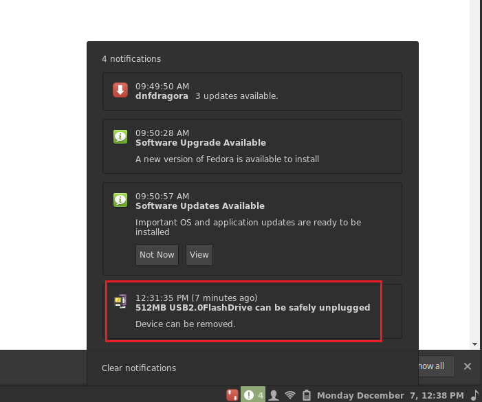 Shows opened Notifications window with 4 Notifications. A red rectangle is around the 4th notification about thumb drive can be safely unplugged and Device can be removed.